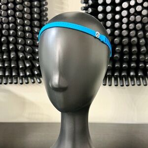Lululemon Blue Elastic Headband with Silver Lululemon Logo Charm